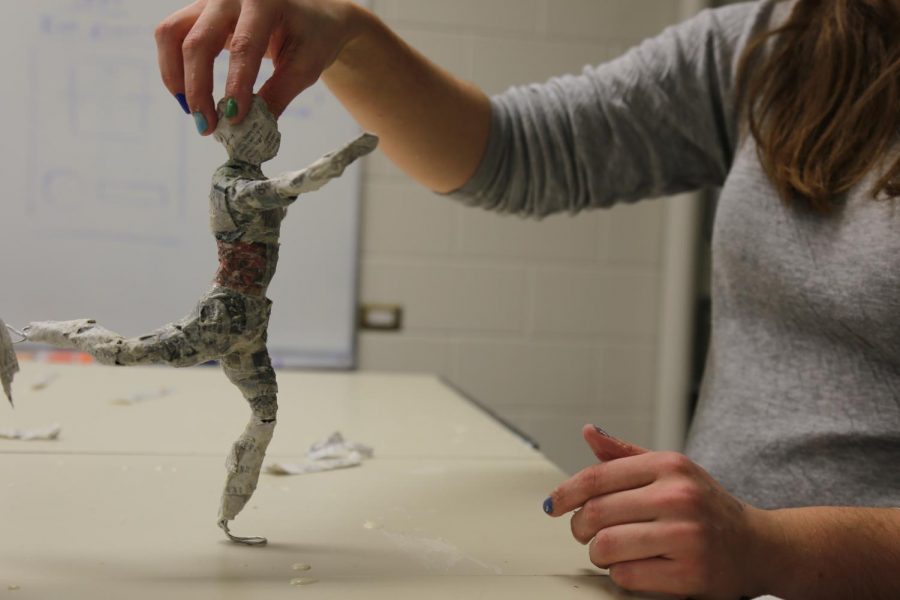 human figure sculture made with paper mache