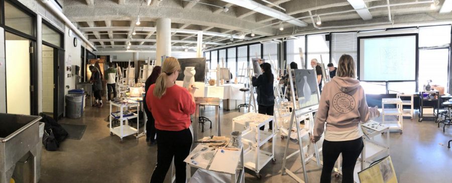 Students painting in an art classroom on west campus at Century College.