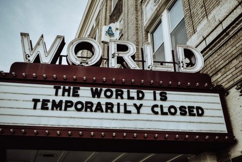 World Theater sign reads The World is Temporarily Closed