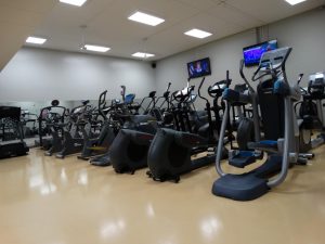 Image of the elliptical and bike machines in the Century College weight room.