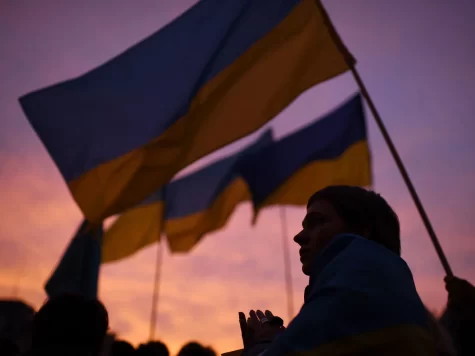 Ukrainian flag flying at sunset.