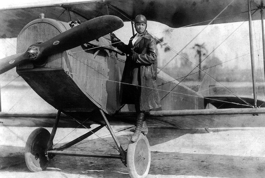 Bessie+Coleman+and+her+plane+in+1922.