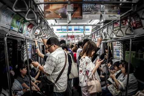 crowd of people on their phones