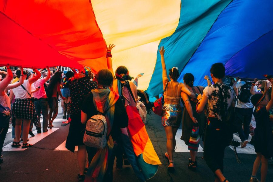 people+gathered+under+a+pride+flag