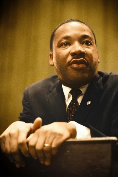 A picture of Dr. Martin Luther King leaning on a podium.
